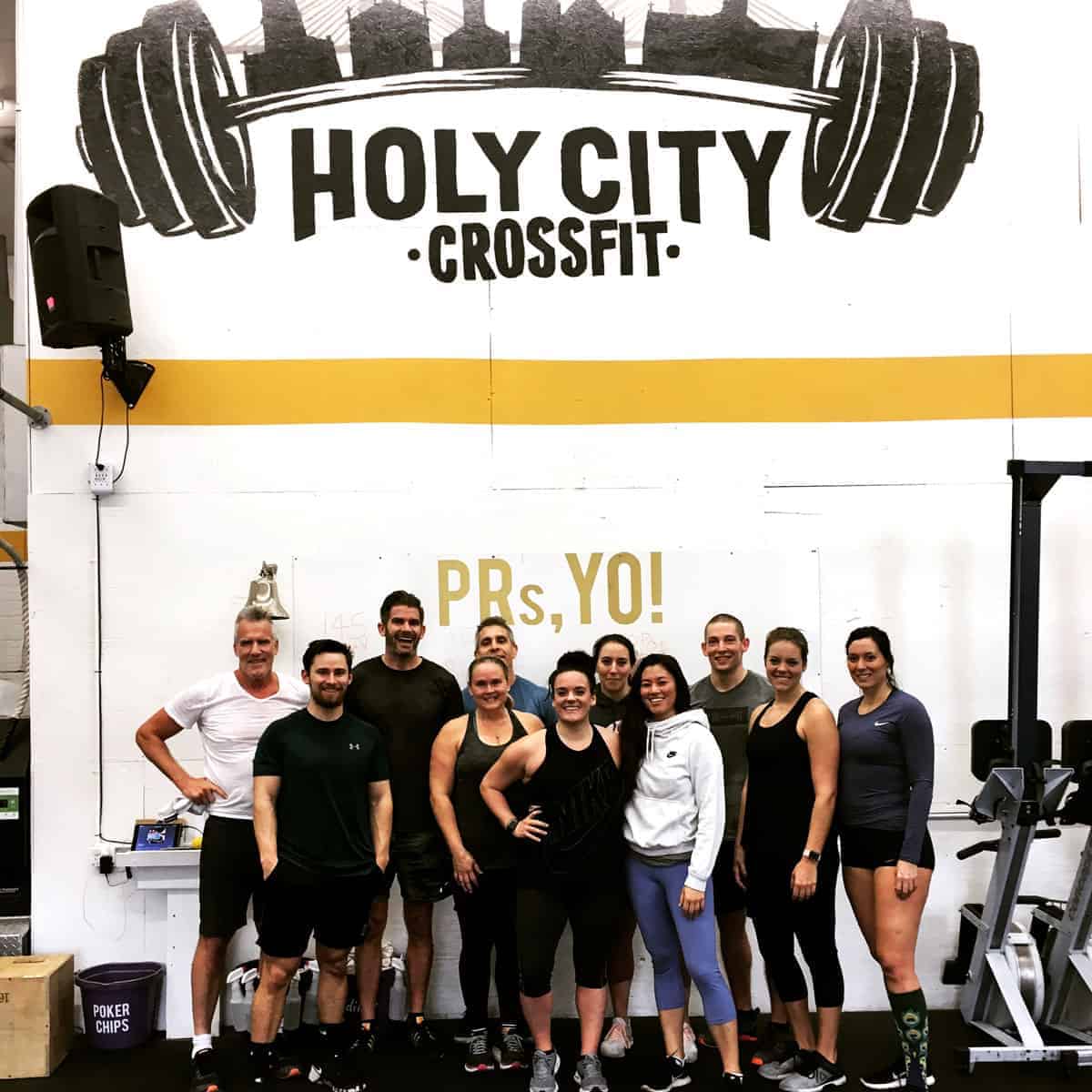 group of people smiling in a gym